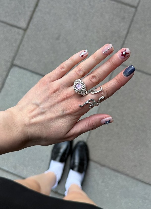 Hand wearing handmade silver rings